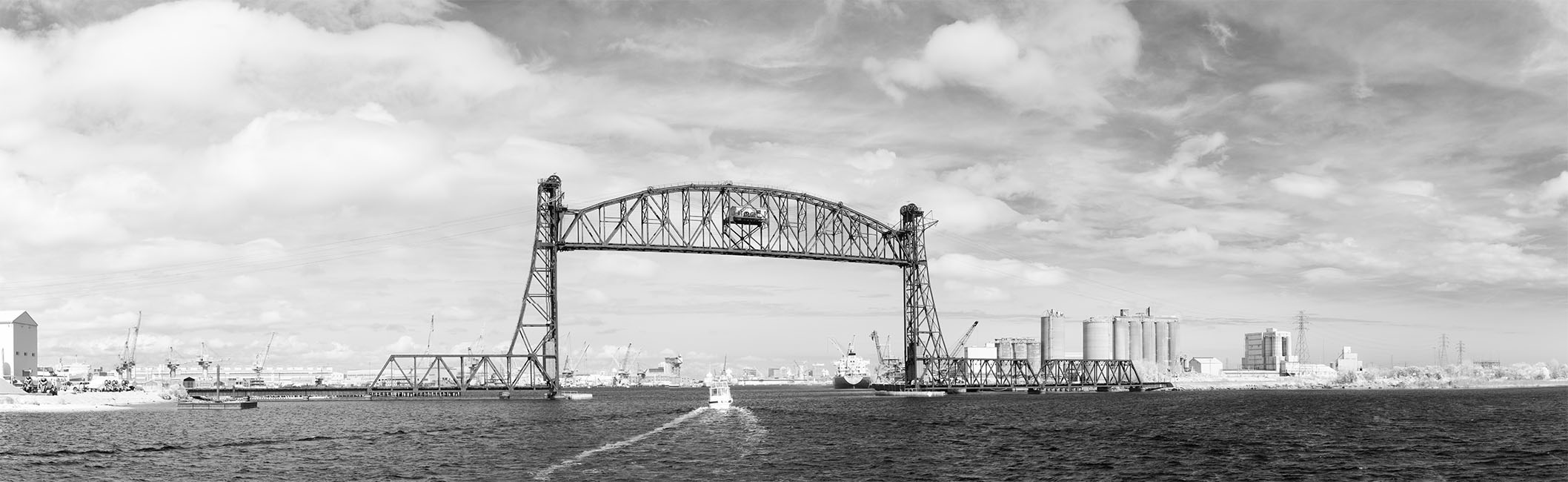 Infrared Panorama of Motor Yacht and Wake Passing Through Steel Lift Bridge.